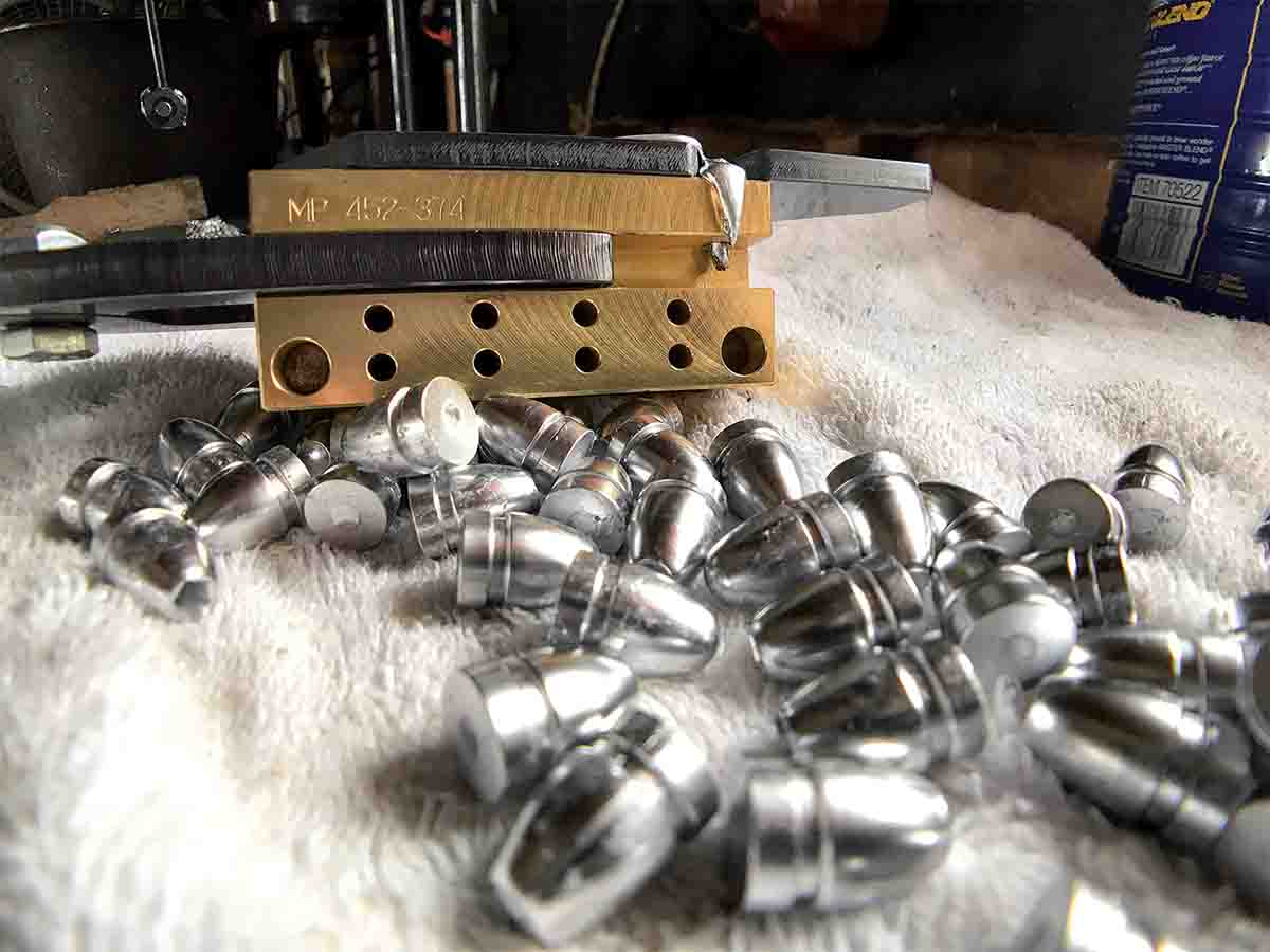 MP four-cavity brass moulds are big and require preheating and casting a few times to bring them up to the correct  temperature to produce fully formed bullets.